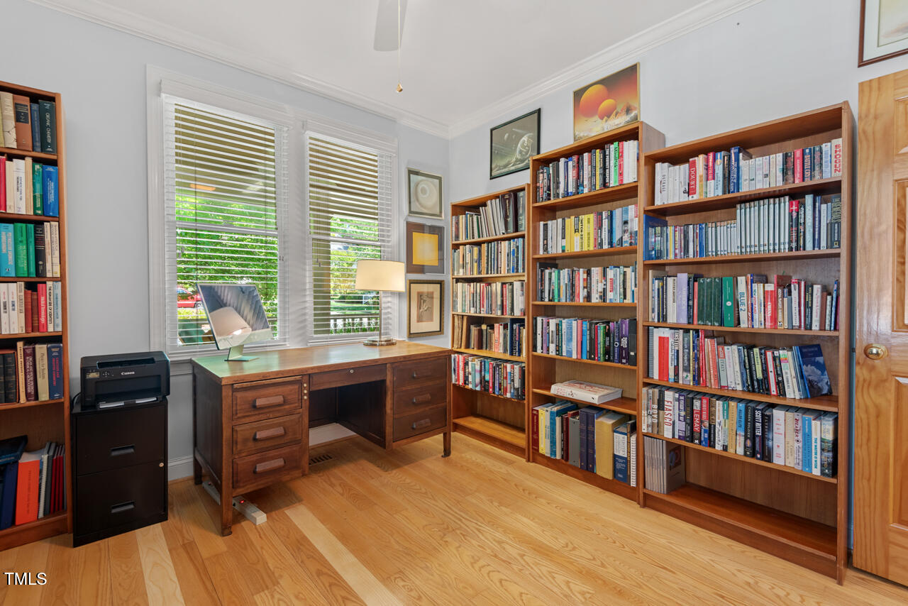 30119 Settle Chapel Hill, NC 27517 - Photo 31 of 49 a room with furniture book shelf and a window