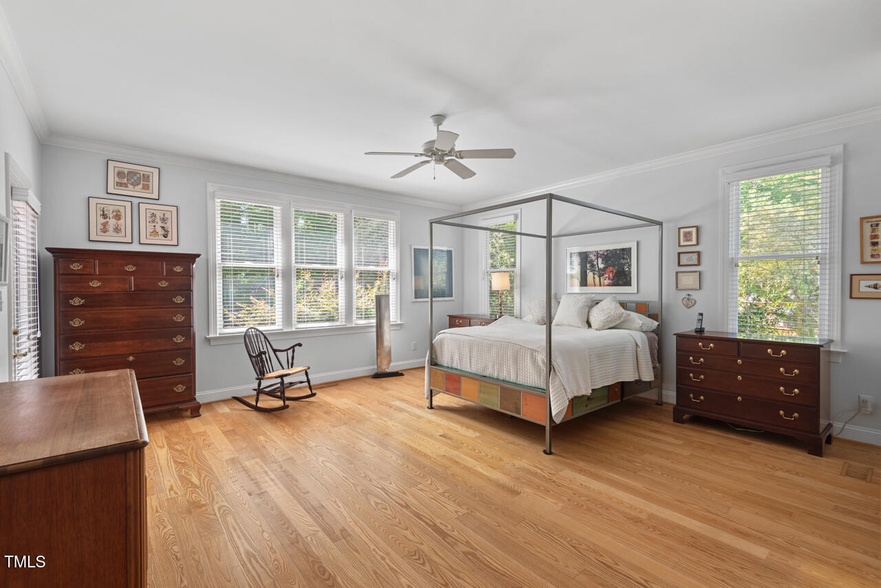 30119 Settle Chapel Hill, NC 27517 - Photo 32 of 49 a bedroom with a bed and a dresser next to a window