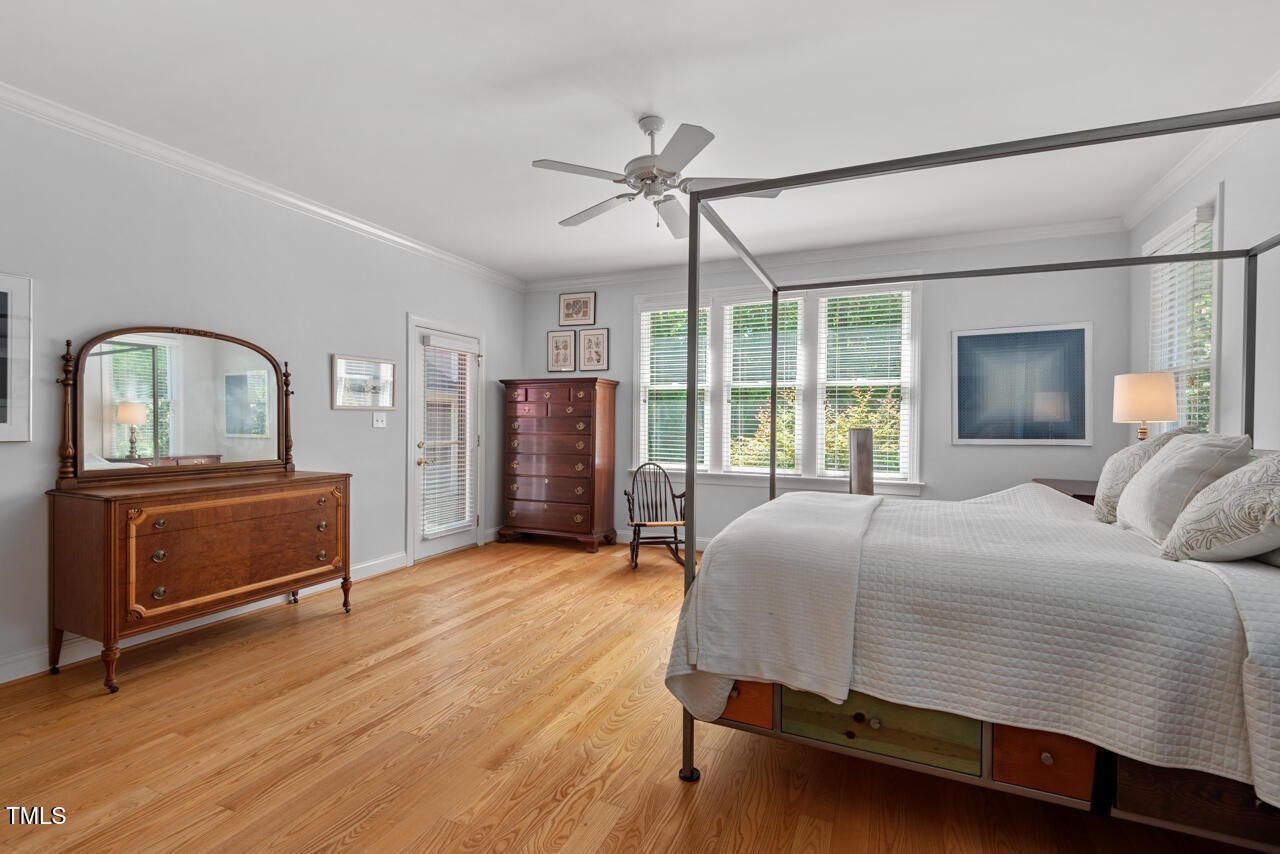 30119 Settle Chapel Hill, NC 27517 - Photo 33 of 49 a bedroom with a bed next to a large window with the outer view