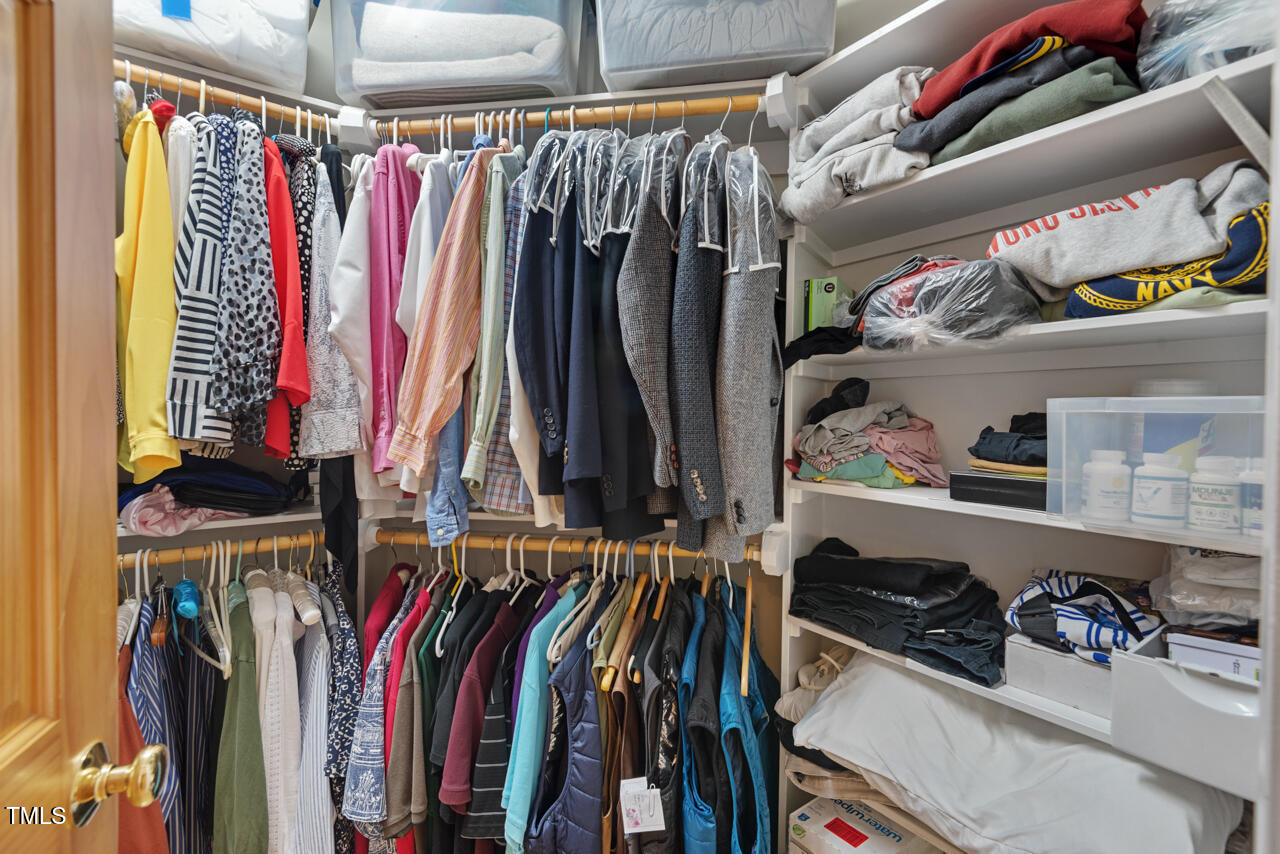 30119 Settle Chapel Hill, NC 27517 - Photo 40 of 49 a view of walk in closet with clothes and shoes