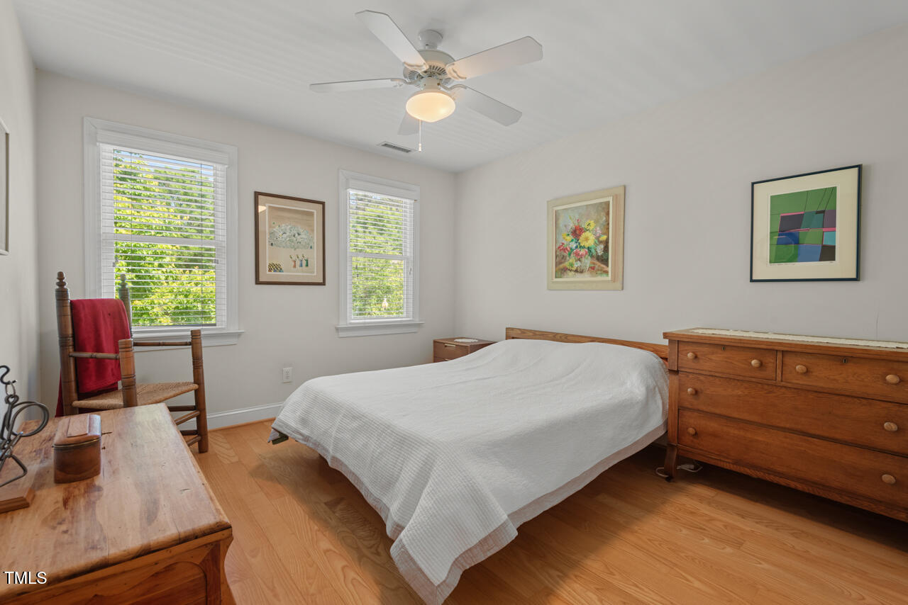 30119 Settle Chapel Hill, NC 27517 - Photo 46 of 49 a bedroom with a bed dresser and a window