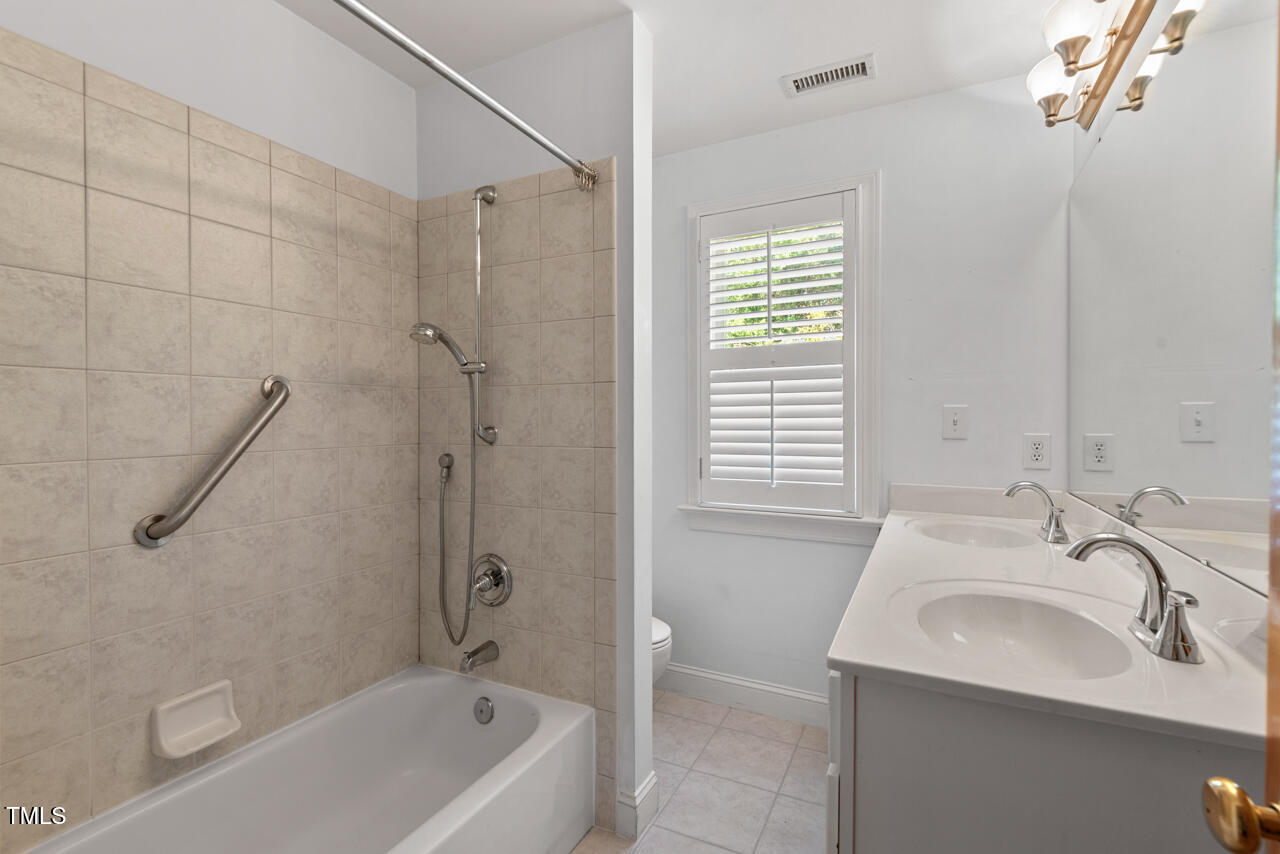 30119 Settle Chapel Hill, NC 27517 - Photo 47 of 49 a bathroom with a sink a bathtub and shower