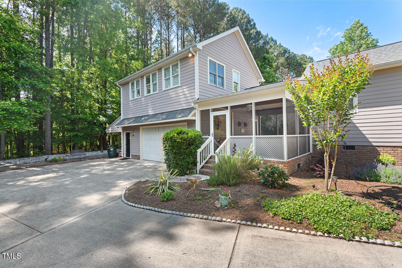 30119 Settle Chapel Hill, NC 27517 - Photo 48 of 49 a front view of a house with garden