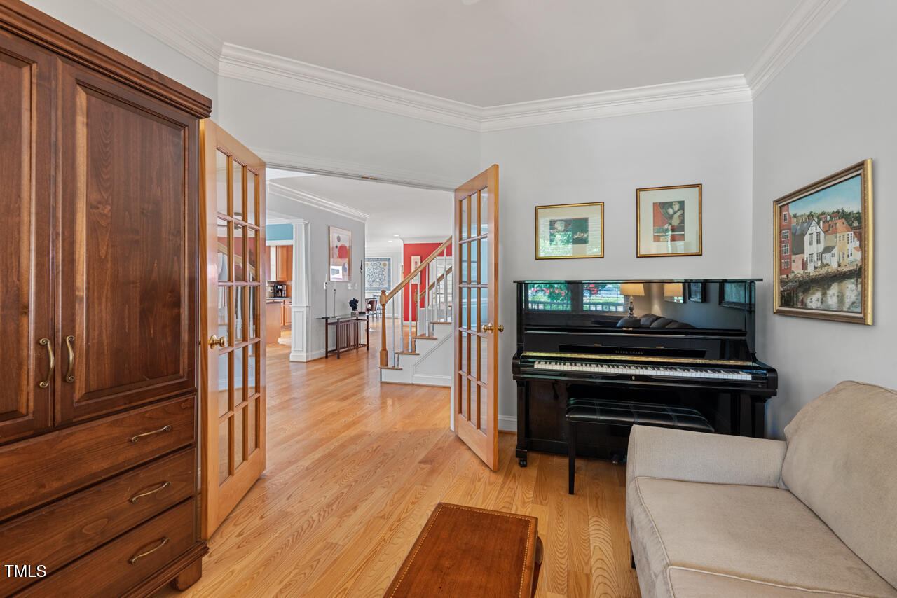 30119 Settle Chapel Hill, NC 27517 - Photo 7 of 49 a living room with furniture and a wooden floor
