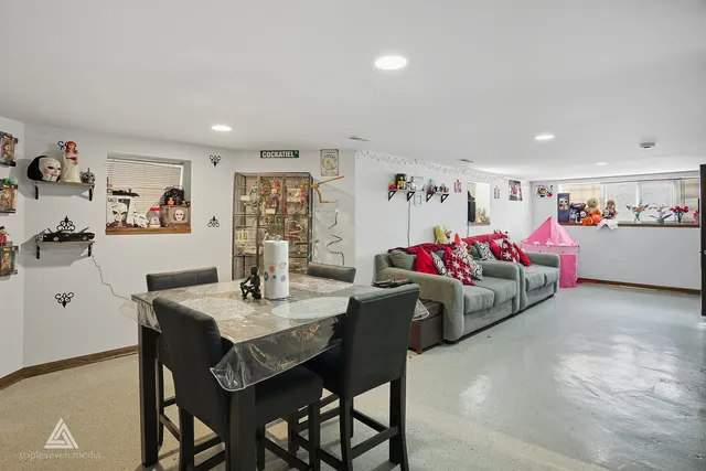 a kitchen with stainless steel appliances granite countertop a refrigerator and a stove