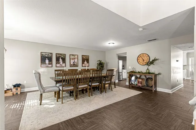 a view of a dining room with furniture