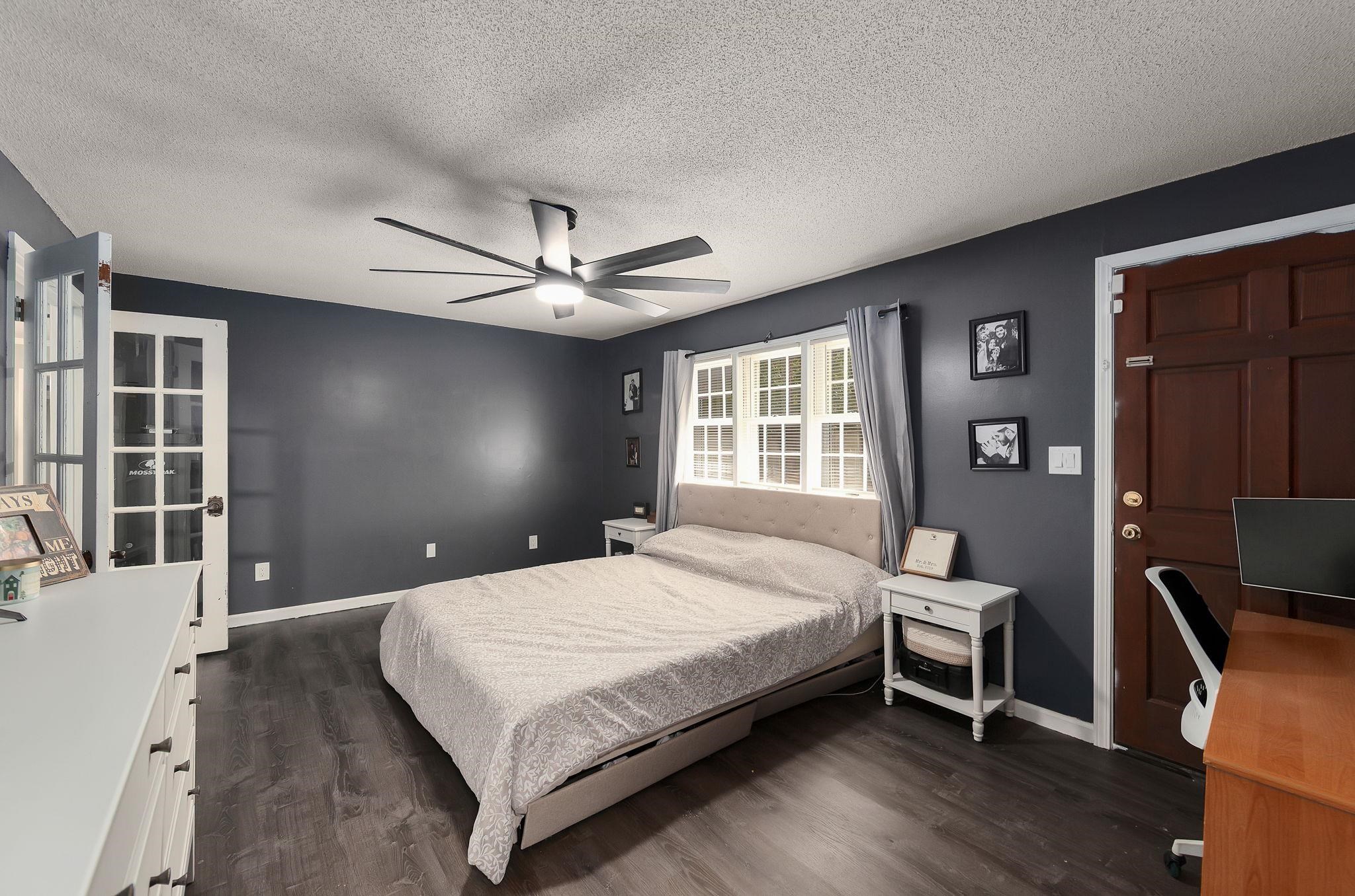 795 Burnett Mills Road Bolivar, TN 38008 - Photo 14 of 29 a bedroom with a bed window and a table