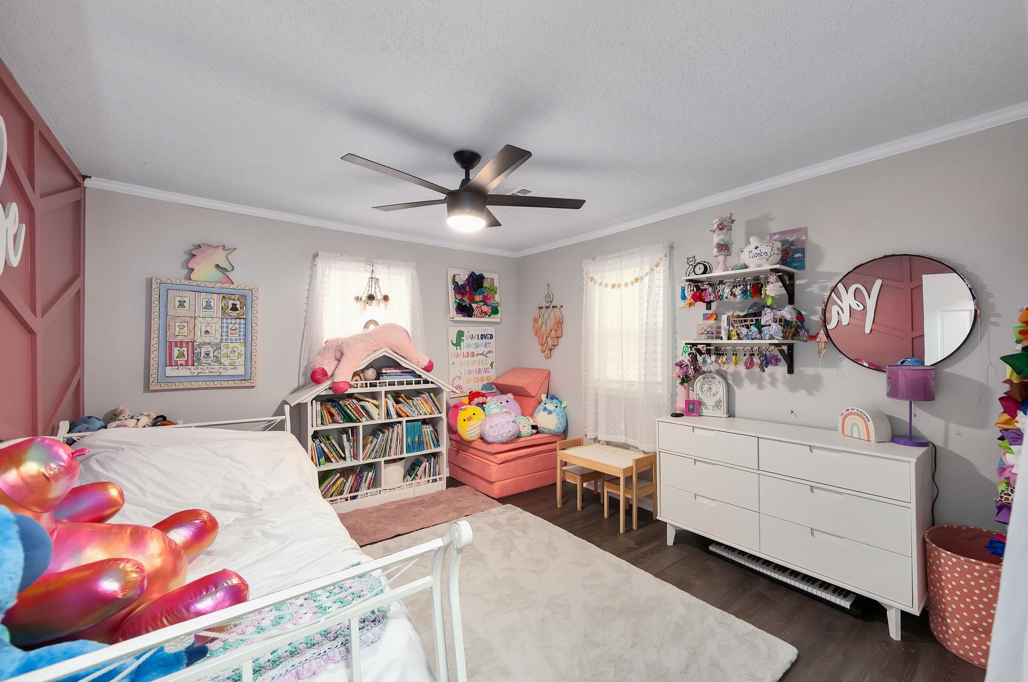 795 Burnett Mills Road Bolivar, TN 38008 - Photo 16 of 29 a bedroom with furniture and a chandelier