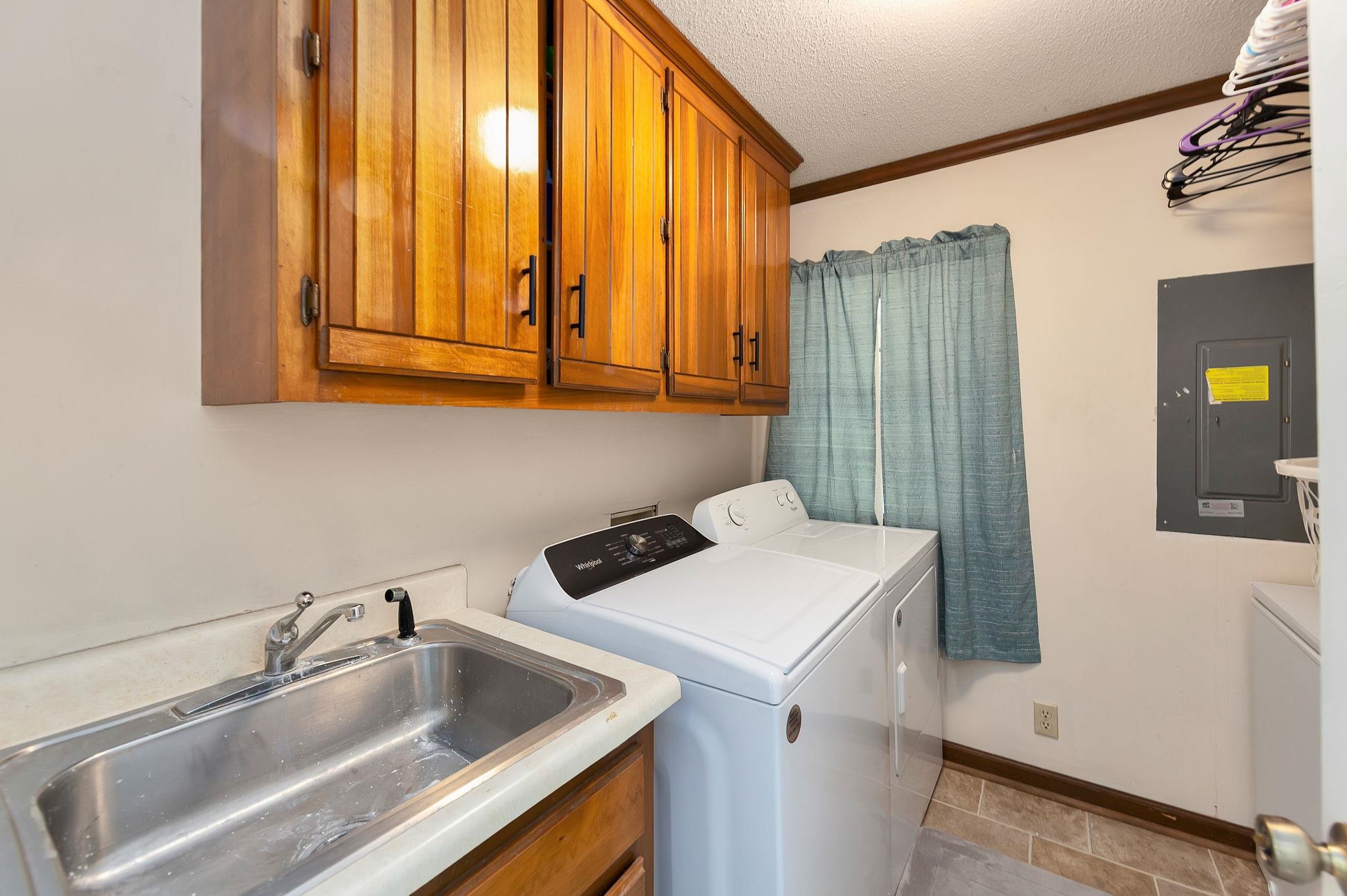 795 Burnett Mills Road Bolivar, TN 38008 - Photo 19 of 29 a utility room with dryer and washer