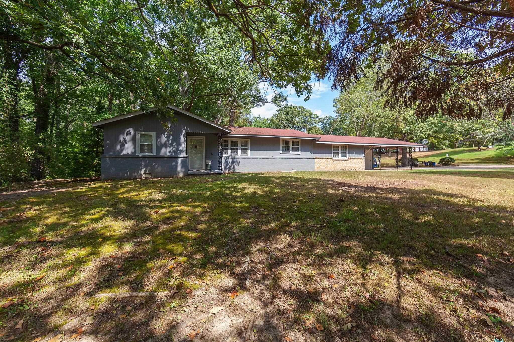 795 Burnett Mills Road Bolivar, TN 38008 - Photo 2 of 29 a house view with a garden space