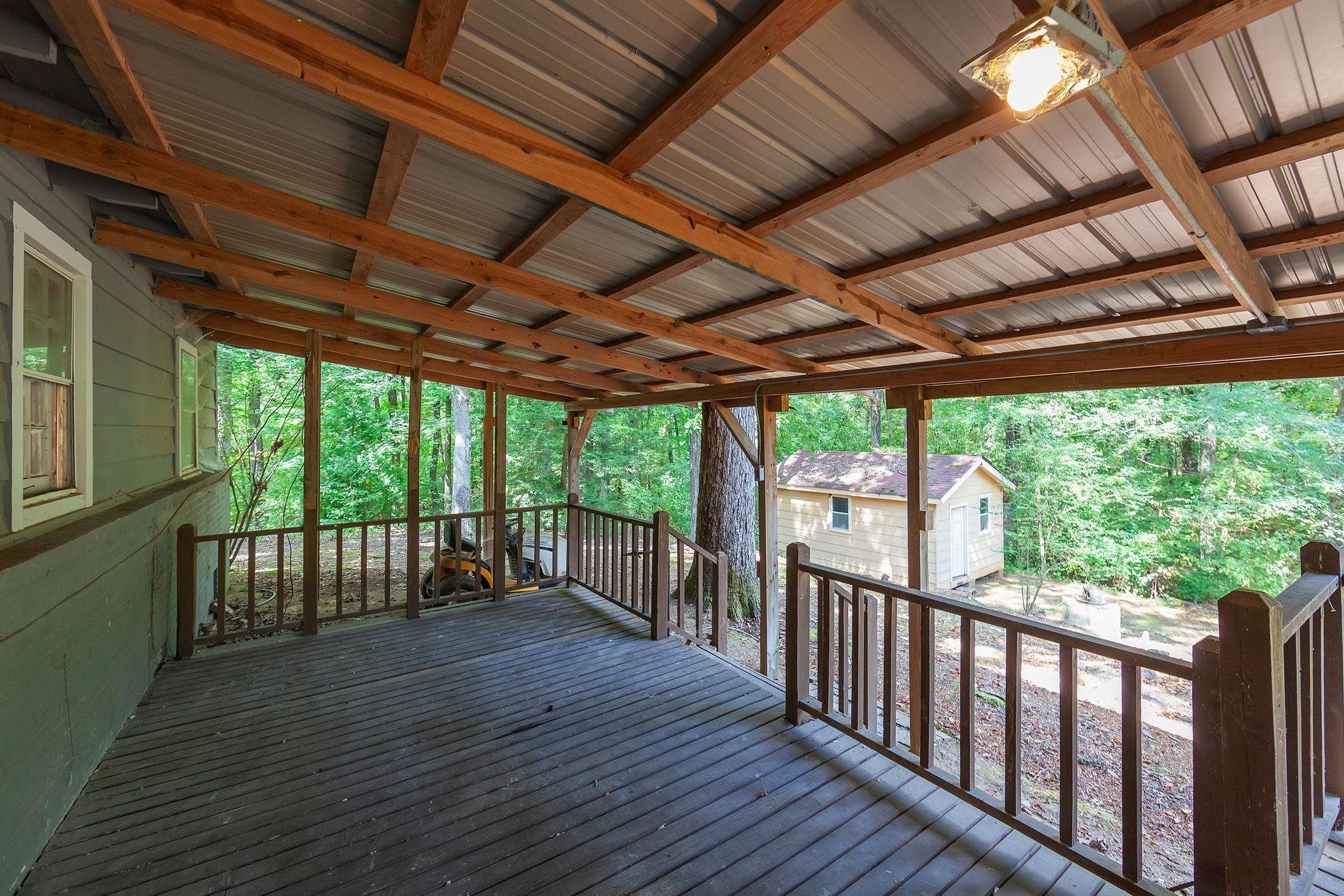 795 Burnett Mills Road Bolivar, TN 38008 - Photo 26 of 29 a view of a porch with wooden floor