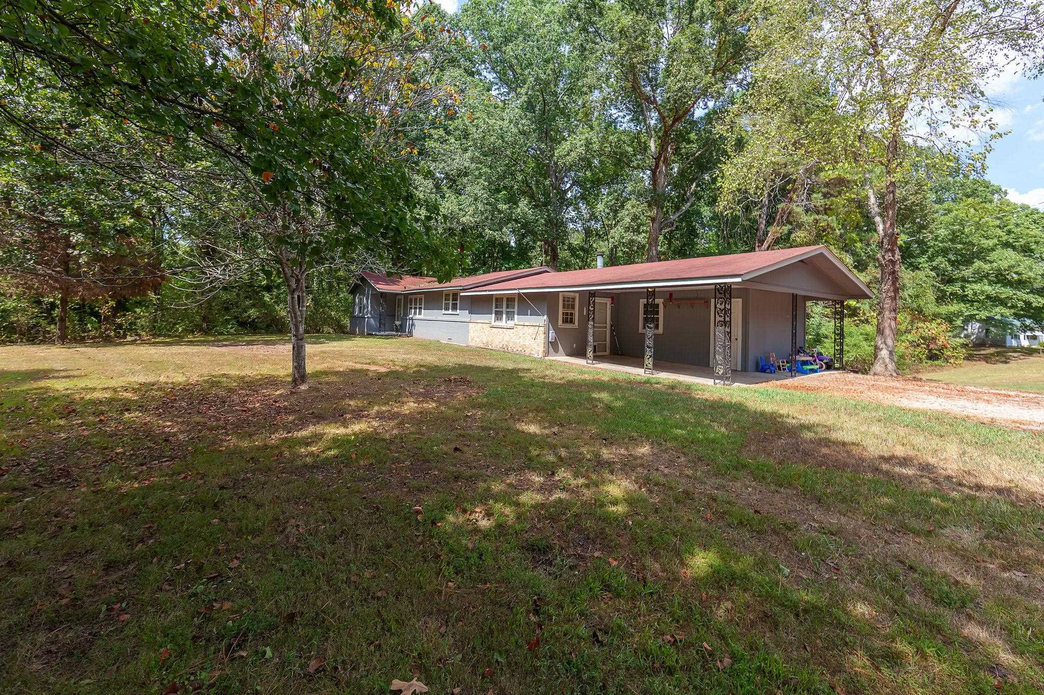 795 Burnett Mills Road Bolivar, TN 38008 - Photo 28 of 29 a house view with a garden space
