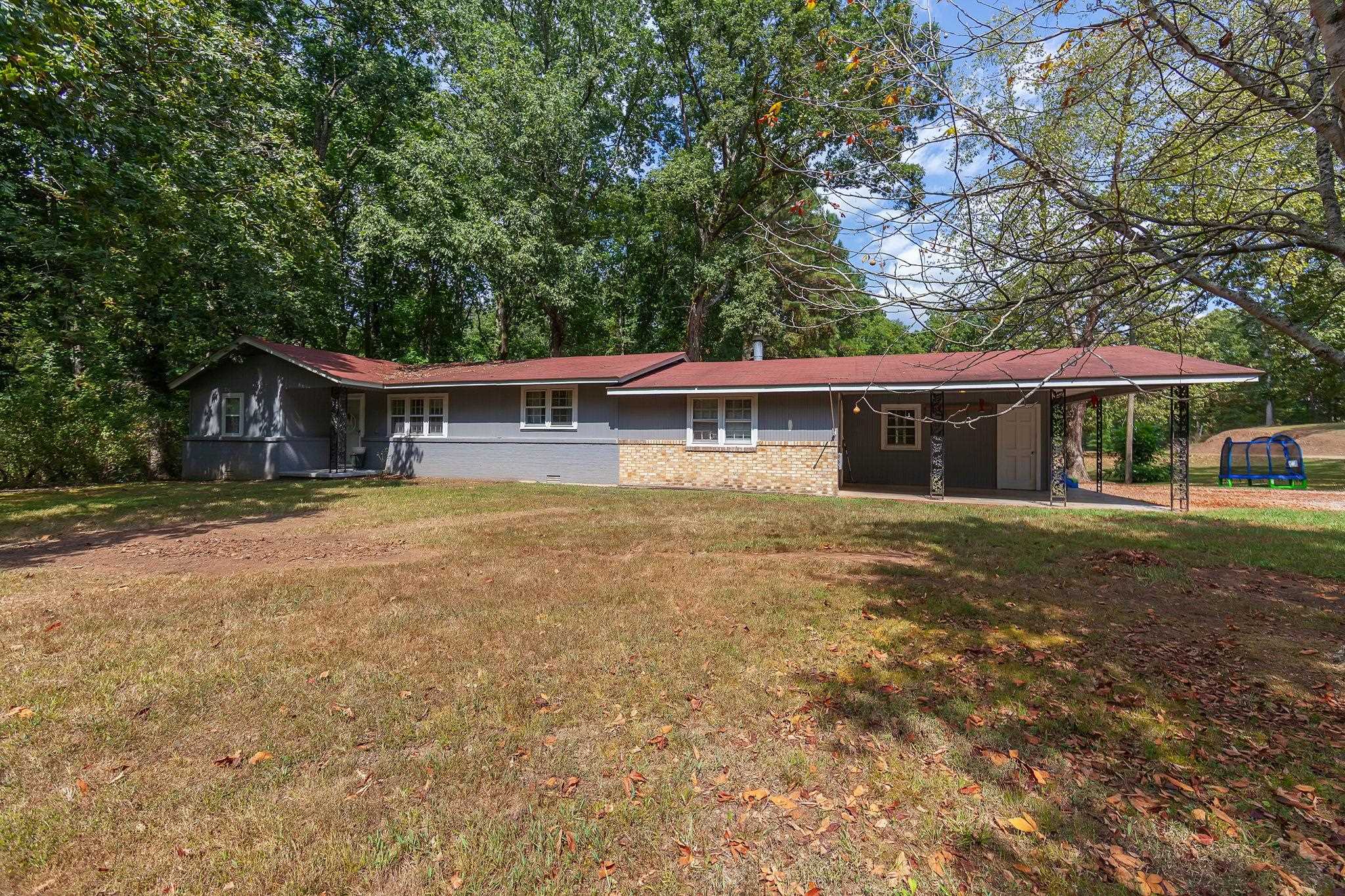 795 Burnett Mills Road Bolivar, TN 38008 - Photo 29 of 29 a front view of a house with a yard