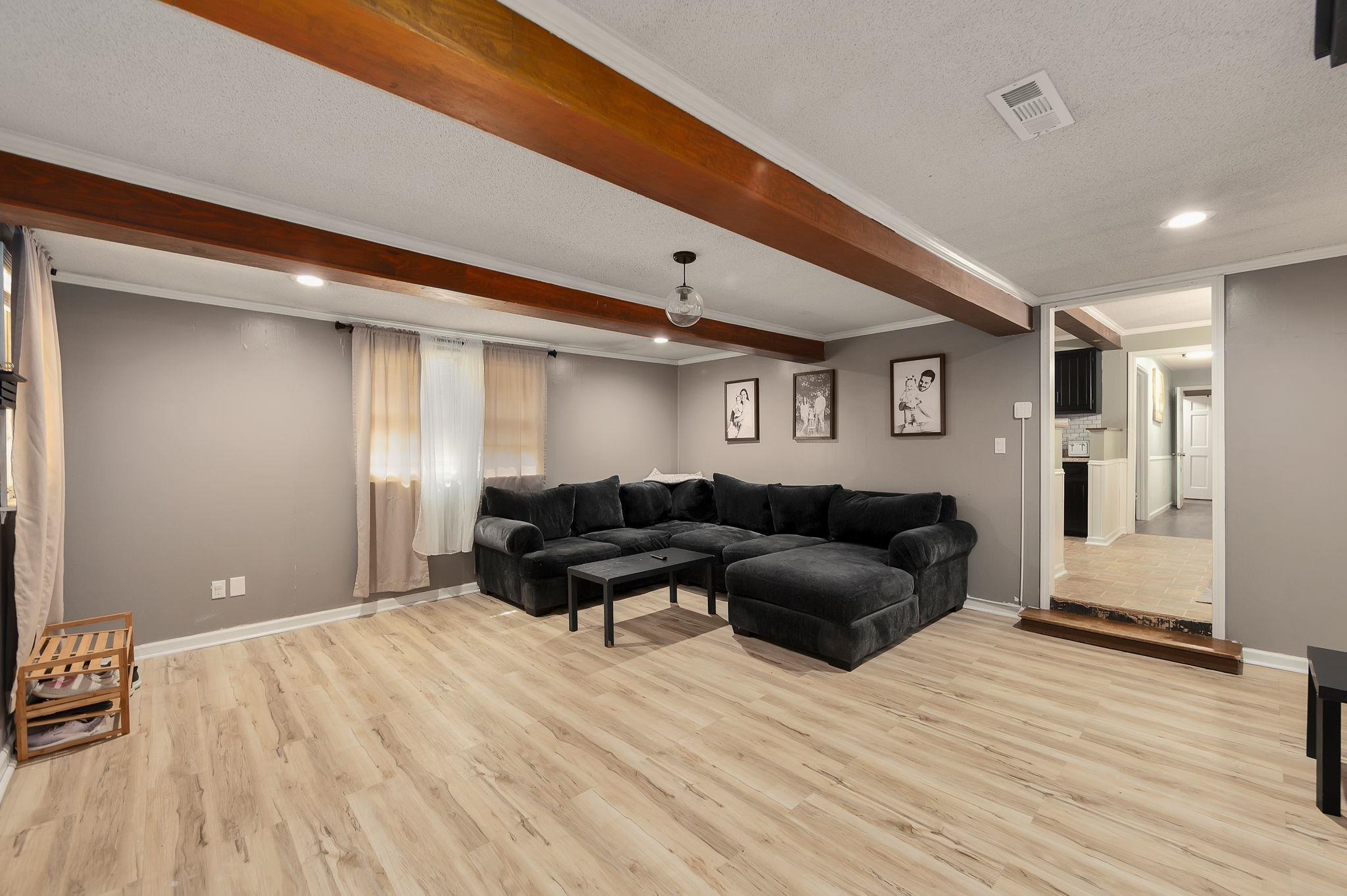 795 Burnett Mills Road Bolivar, TN 38008 - Photo 9 of 29 a living room with furniture and a wooden floor