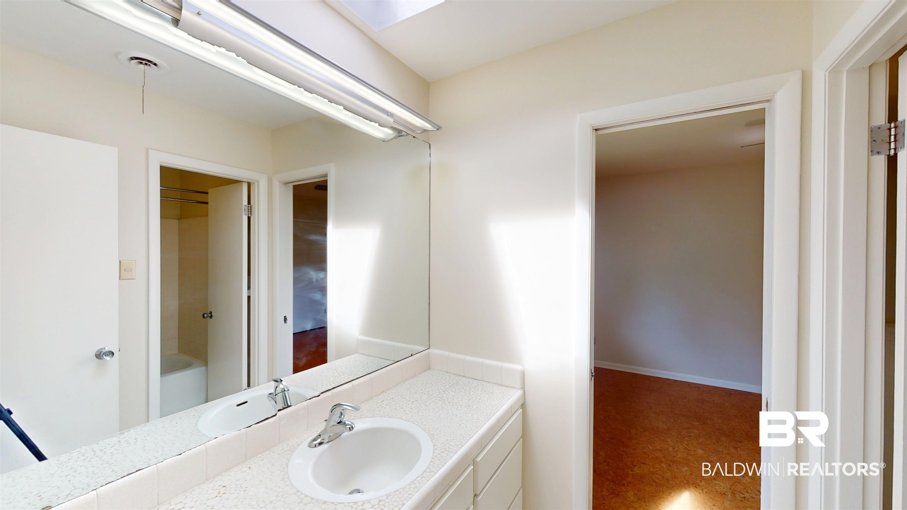 15 Spring Bank Road Mobile, AL 36608 - Photo 39 of 58 Bathroom featuring vanity and a skylight