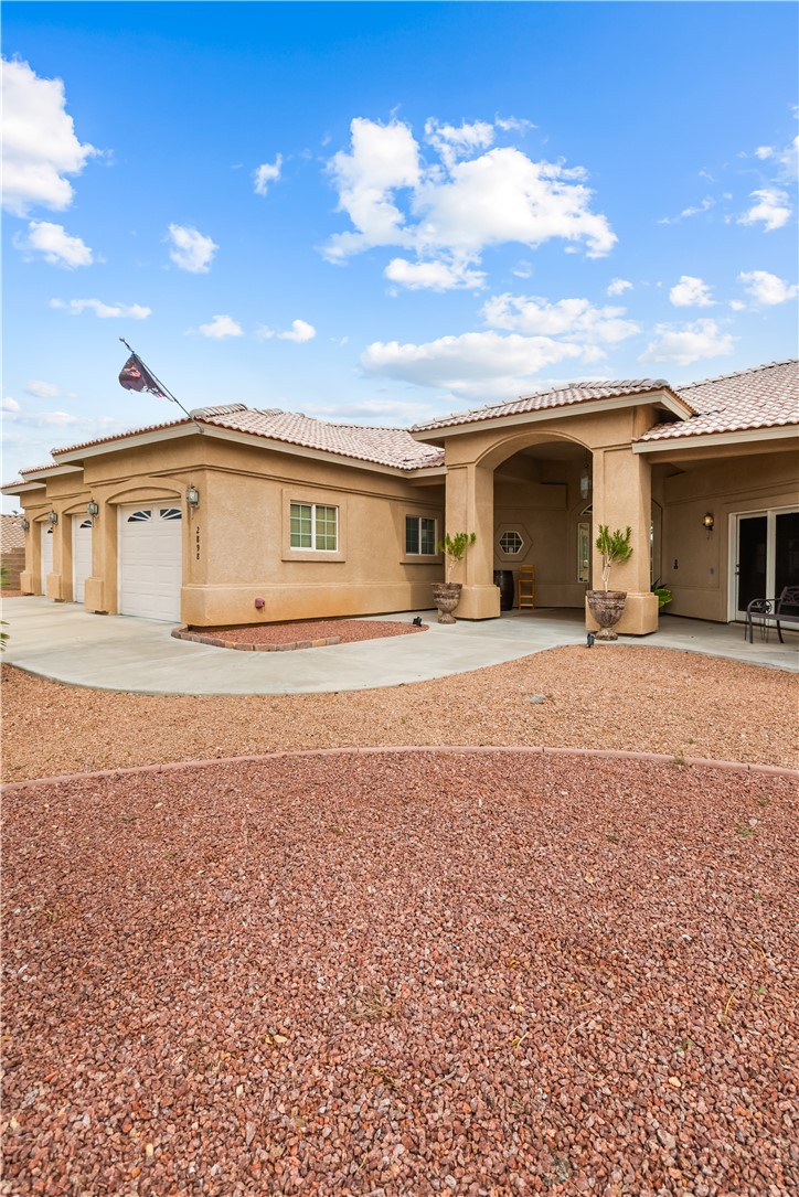 2898 Mountain Trail Road Kingman, AZ 86401 - Photo 60 of 75 a view of a house with a yard
