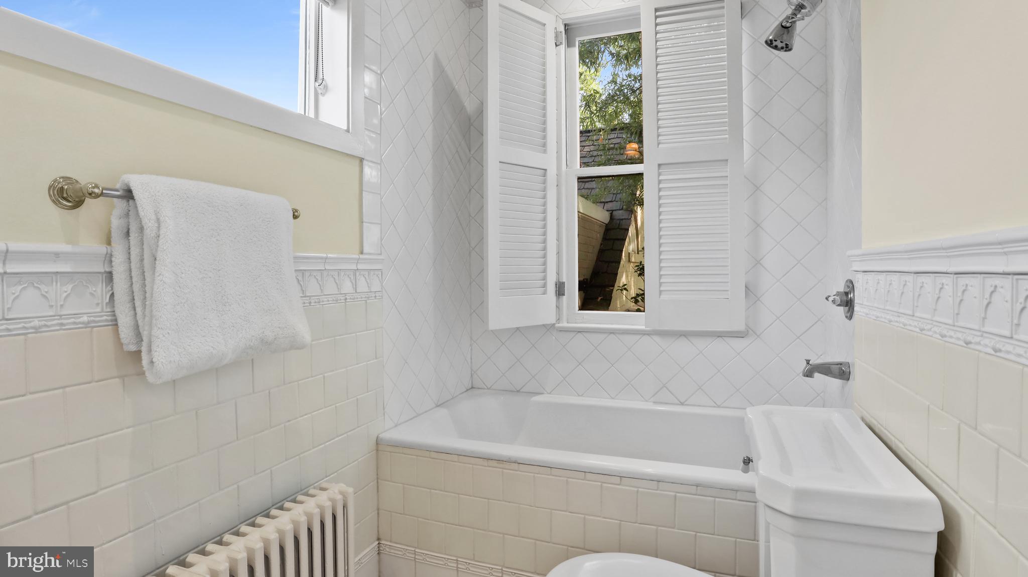 3310 R Street Northwest Washington, DC 20007 - Photo 23 of 31 Tub-shower tucked away for privacy.