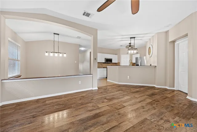 a view of a kitchen with a sink and cabinets