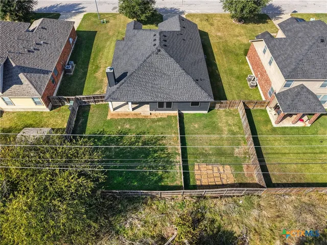 an aerial view of a house with swimming pool