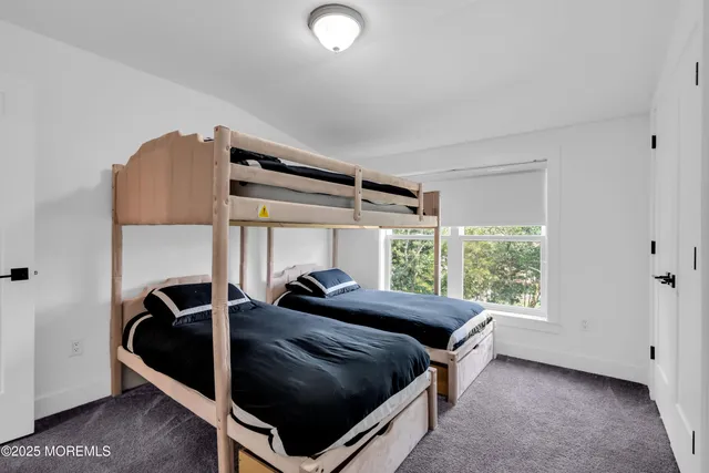 a bed room with a bed and a window