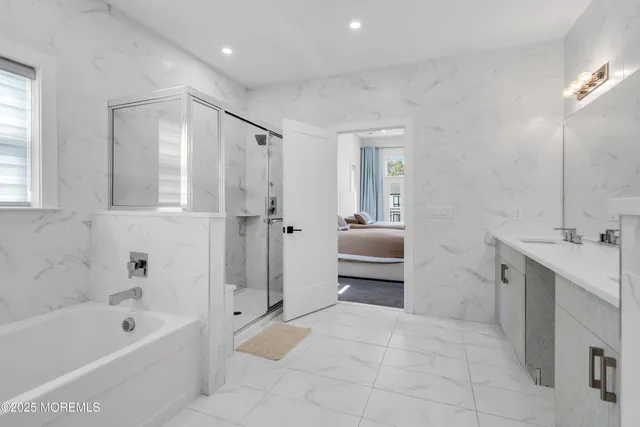 a spacious bathroom with a bathtub sink and toilet