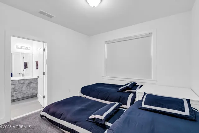 a room with pool table and couch