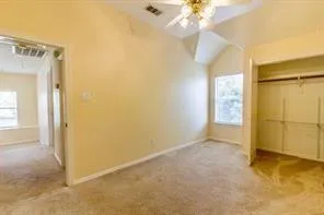 an empty room with a empty space and a ceiling fan
