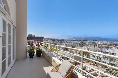 a view of a balcony with city view