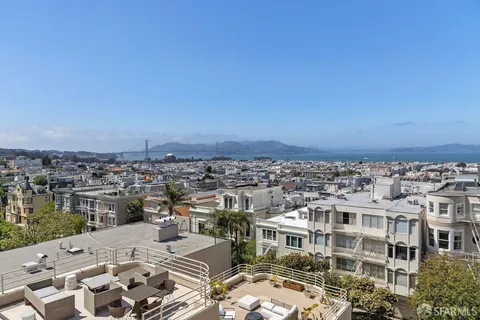 an aerial view of a building with a ocean view
