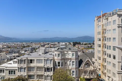 a view of a large building with a city view