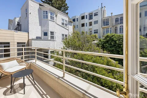 a view of a balcony with chairs