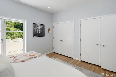 a bathroom with a granite countertop sink a toilet and with mirror