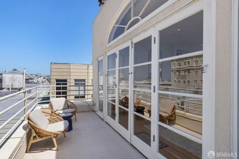 a view of a balcony with chairs