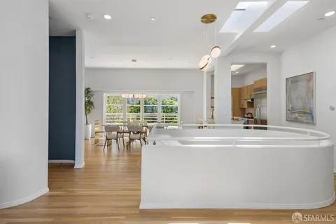 a view of living room with furniture and large windows