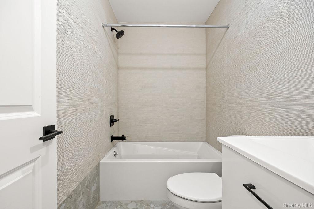 62 Blauvelt Road, Unit 202 Monsey, NY 10952 - Photo 33 of 34 a bathroom with a toilet and a bath tub