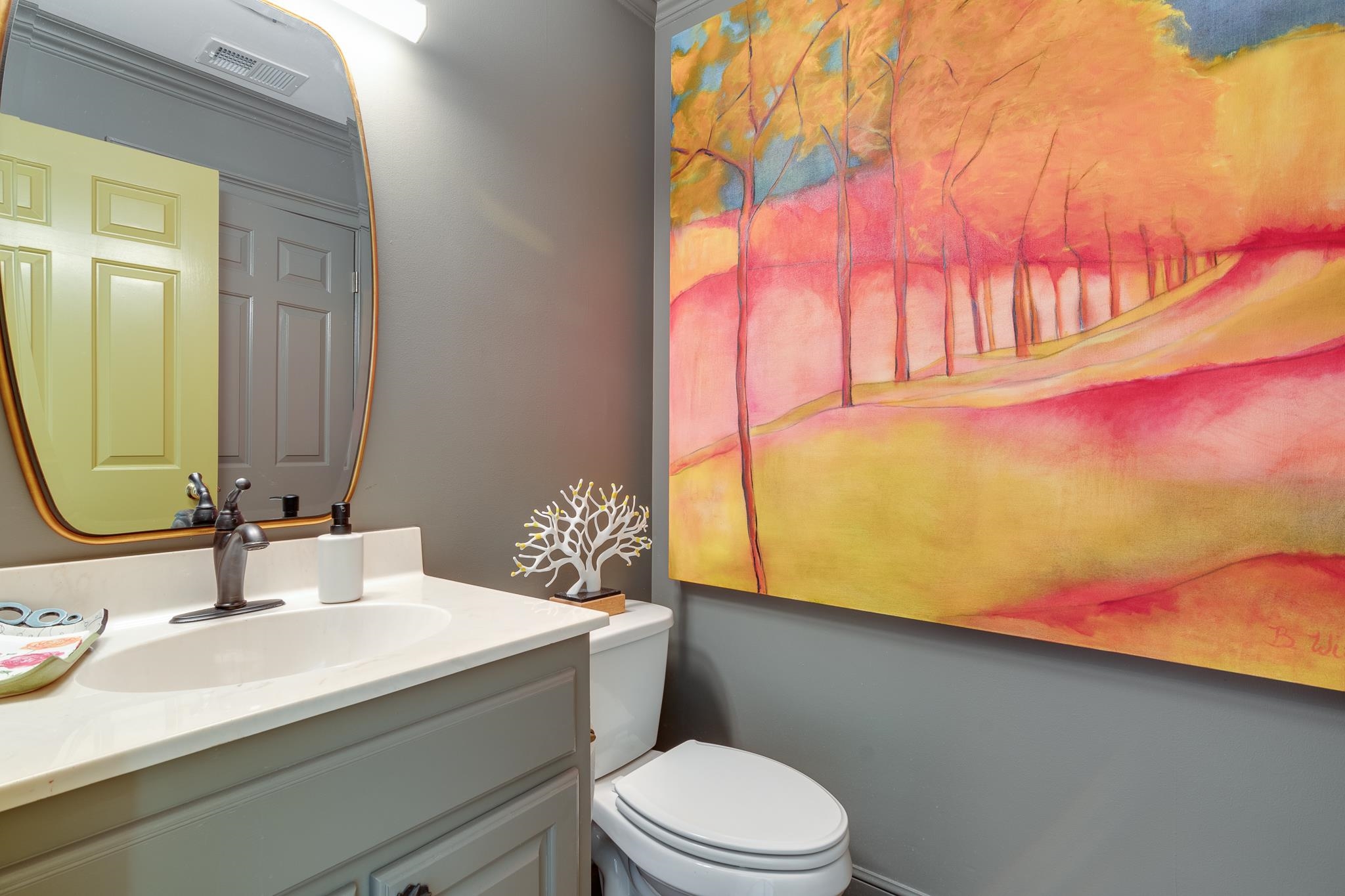 338 Greenway Road Memphis, TN 38117 - Photo 26 of 40 a bathroom with a sink vanity mirror and toilet