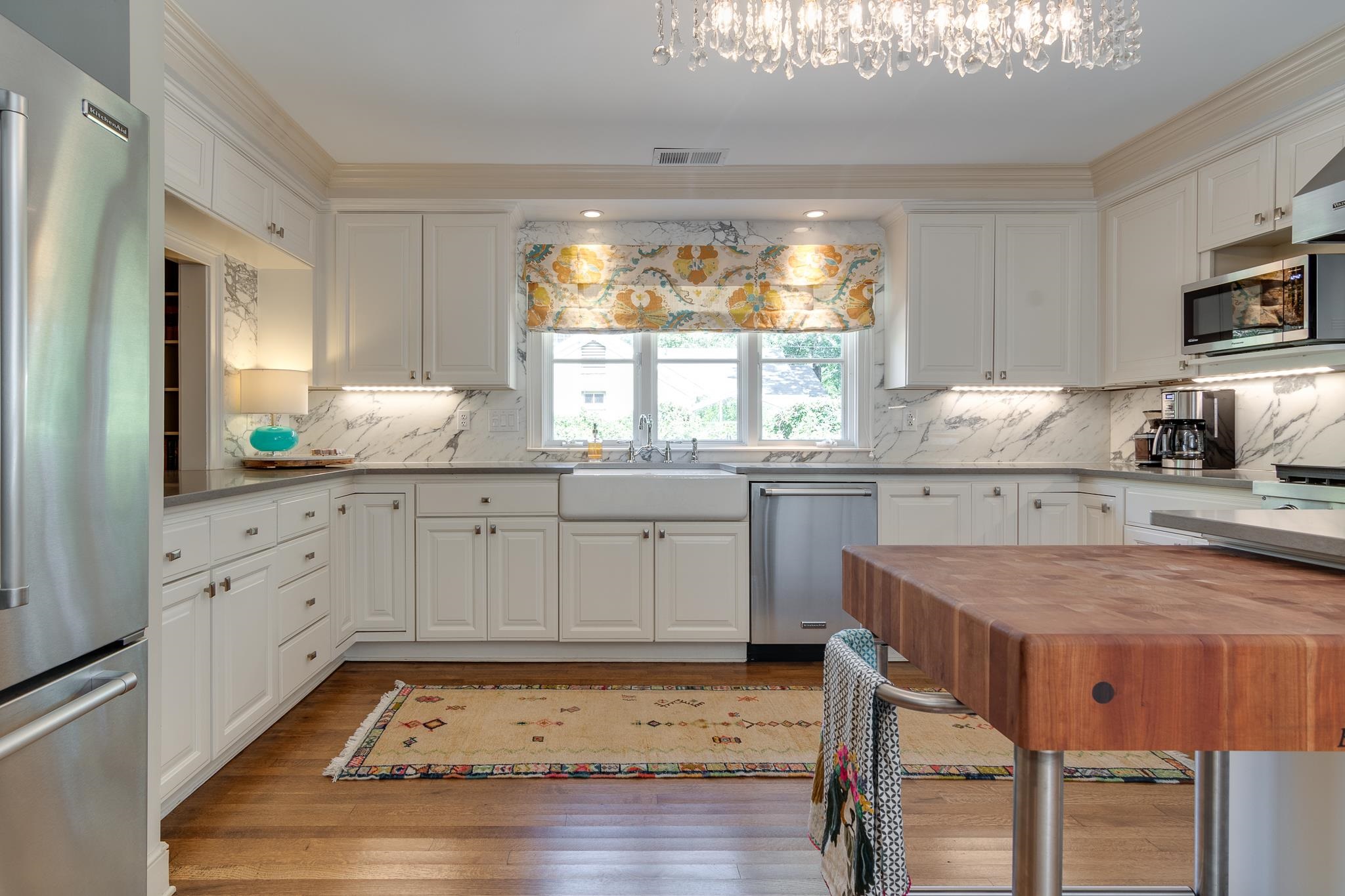 338 Greenway Road Memphis, TN 38117 - Photo 29 of 40 a kitchen with granite countertop white cabinets and white appliances