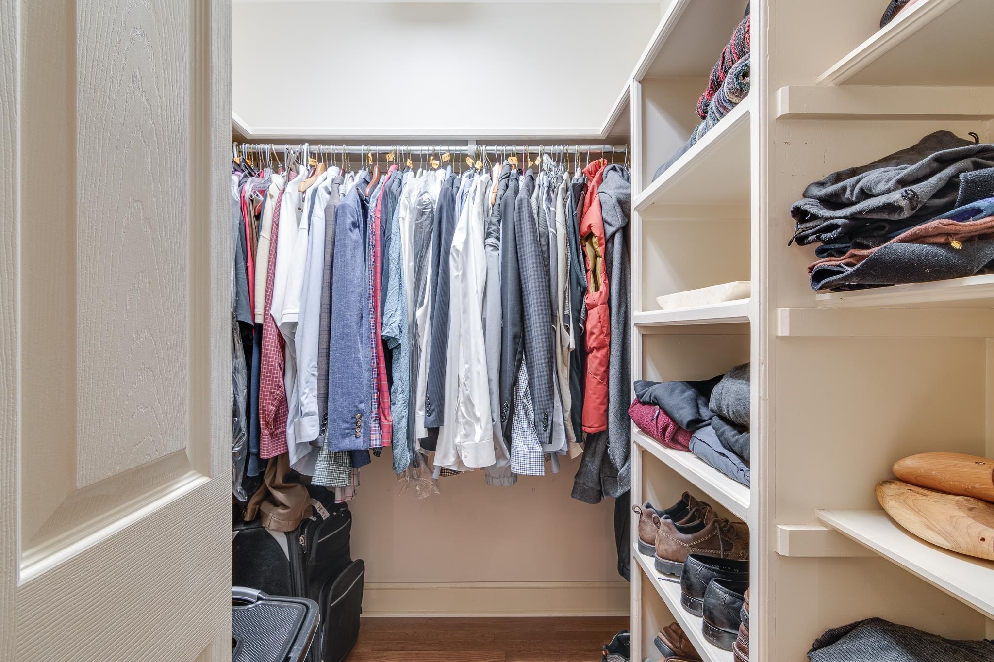 338 Greenway Road Memphis, TN 38117 - Photo 9 of 40 a view of walk in closet with clothes and shoes