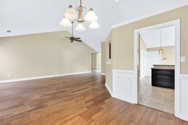 a view of a room with wooden floor
