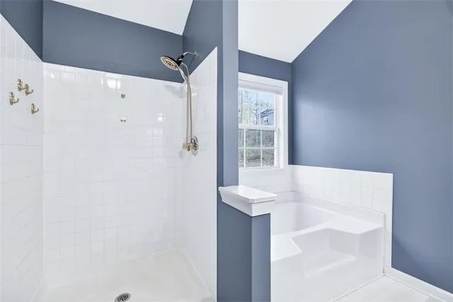 a bathroom with a shower and a sink