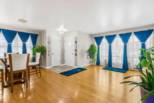 a view of a livingroom with furniture window and wooden floor