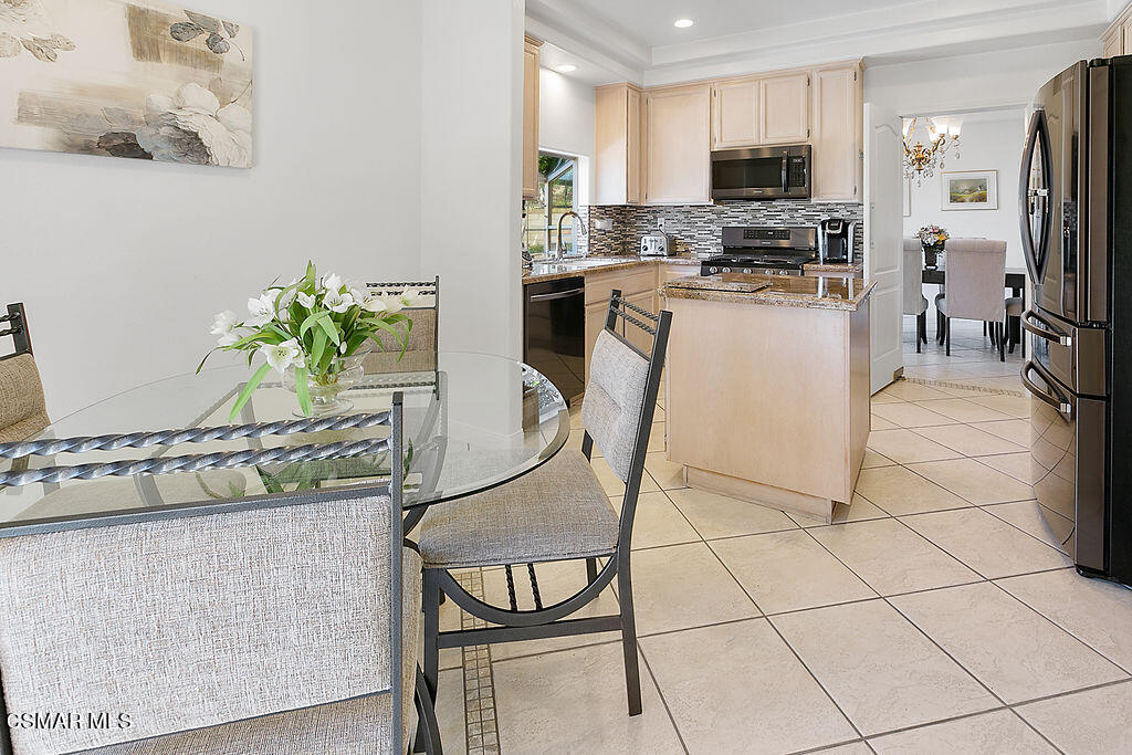 985 Brandon Avenue Simi Valley, CA 93065 - Photo 13 of 40 a kitchen with stainless steel appliances a stove a refrigerator a sink a stove with white cabinets