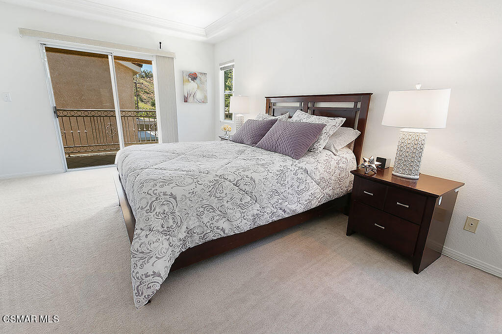 985 Brandon Avenue Simi Valley, CA 93065 - Photo 22 of 40 a bedroom with a bed and a window