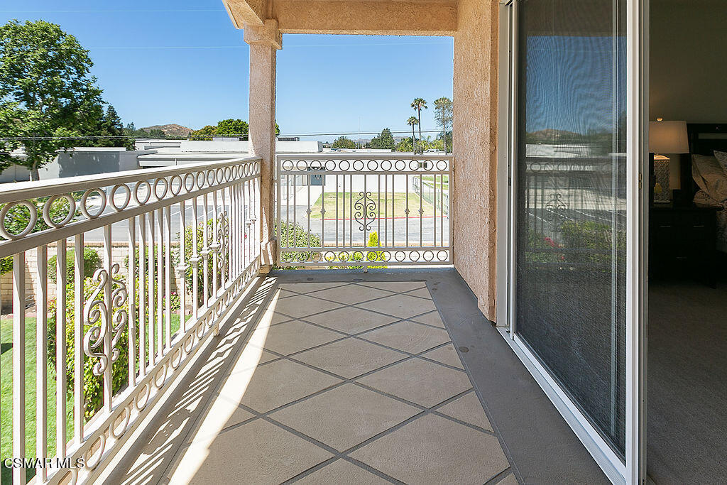 985 Brandon Avenue Simi Valley, CA 93065 - Photo 26 of 40 a view of a balcony with a floor to ceiling window and wooden floor