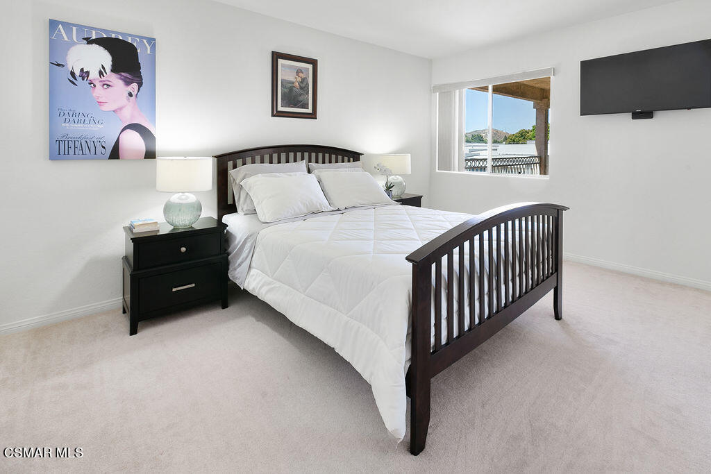 985 Brandon Avenue Simi Valley, CA 93065 - Photo 29 of 40 a bedroom with a bed and window