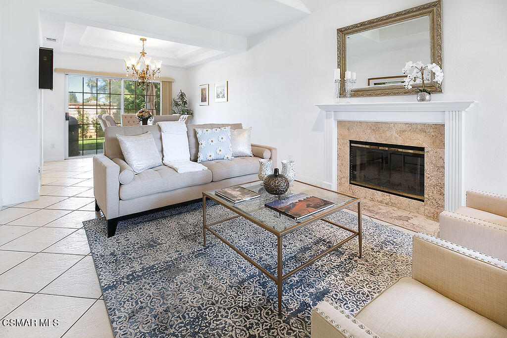985 Brandon Avenue Simi Valley, CA 93065 - Photo 8 of 40 a living room with furniture and a fireplace