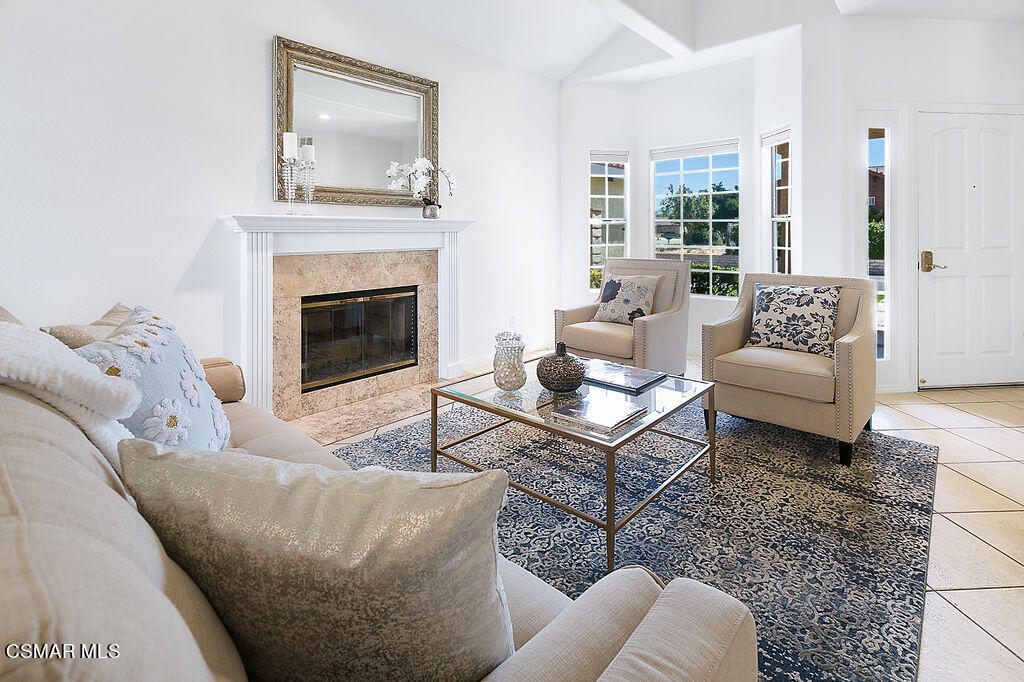 985 Brandon Avenue Simi Valley, CA 93065 - Photo 9 of 40 a living room with furniture a rug and a fireplace