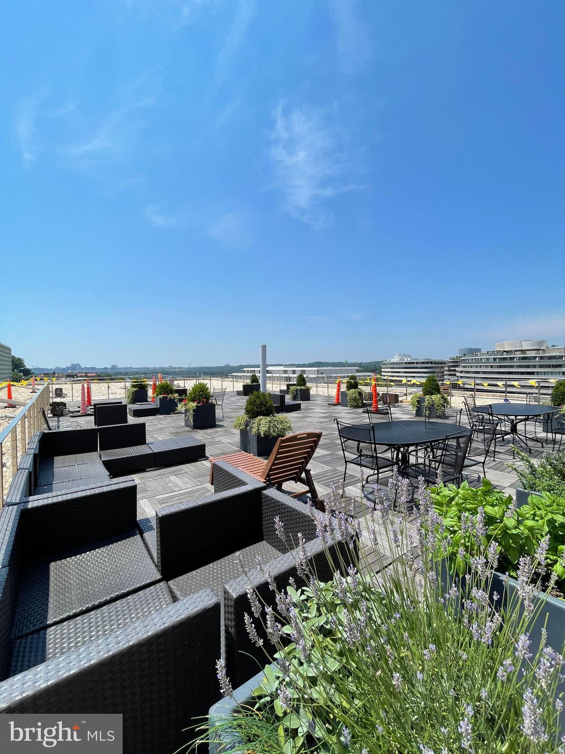 2475 Virginia Avenue Northwest, Unit 411 Washington, DC 20037 - Photo 1 of 20 a terrace with outdoor seating and city view