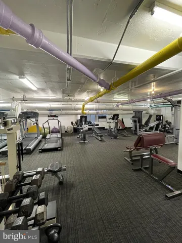 a view of parking garage with lots of car parked