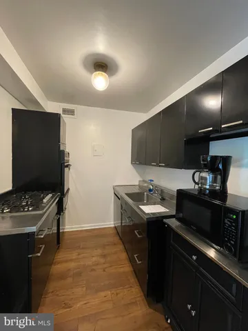 a kitchen with a sink and cabinets